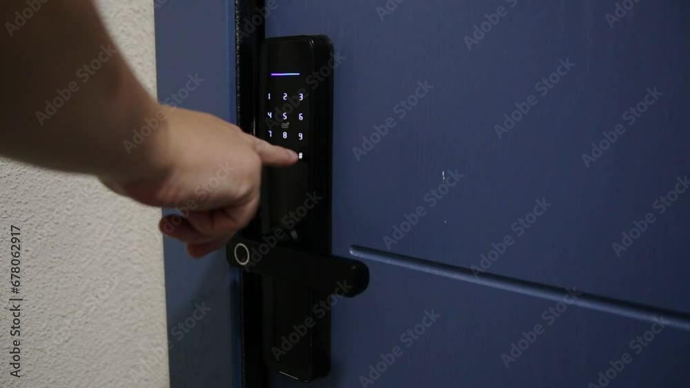 Modern door with an electronic lock to the apartment. Dial an access code to enter the room. Security from burglary and theft, close-up Modern door with an electronic lock to the apartment. Dial an access code to enter the room. Security from burglary and theft, close-up