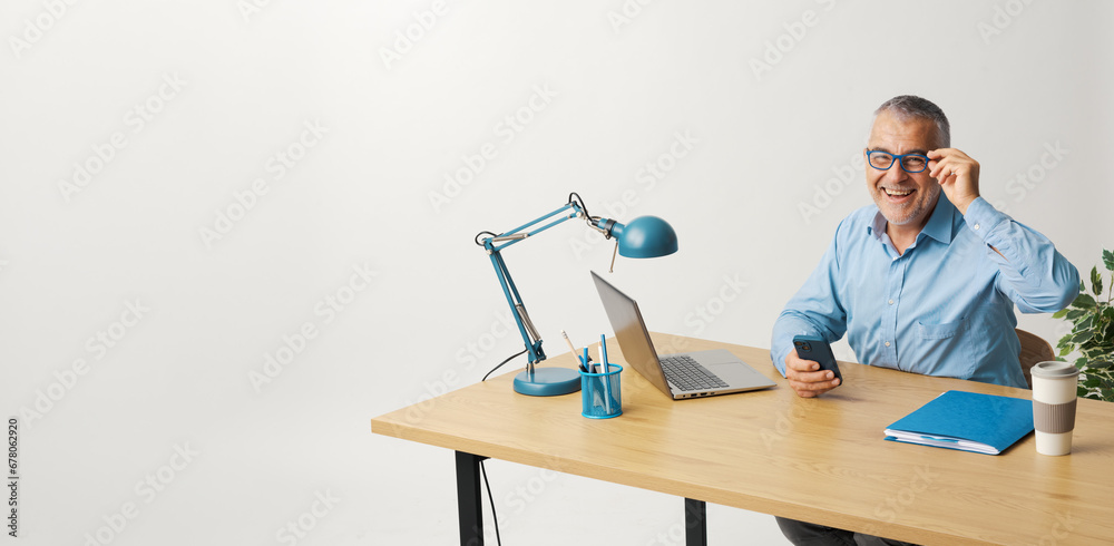 Confident businessman using a smartphone Confident businessman using a smartphone