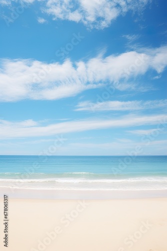 Serene beach scene with soft sandy shore, ocean waves, and a blue sky with fluffy clouds. Vacation mood that speaks of tranquility and relaxation. Peaceful holiday. Relax in the nature