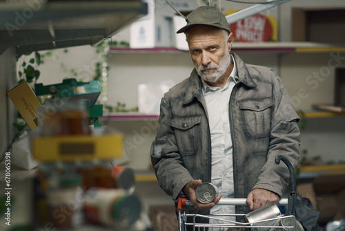Portrait of a desperate man searching for food in a destroyed supermarket