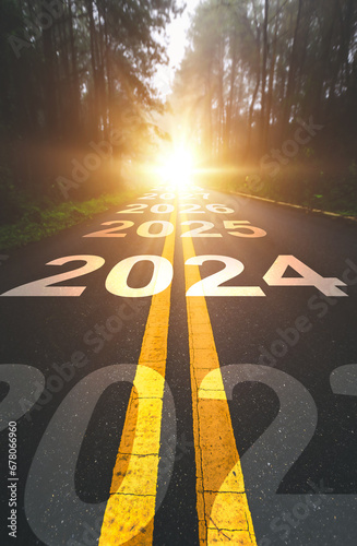 Vertical, 2024 New Year road trip travel and future vision concept . Nature landscape with highway road leading forward to happy new year celebration in the beginning of 2024 for fresh 