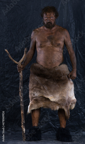 portrait of a caveman in a cave
