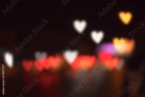 blurred heart shaped bokeh night light .Defocused light background .