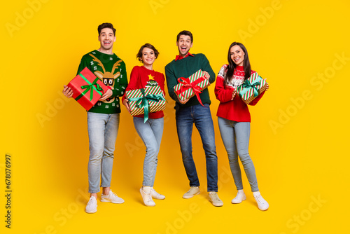 Photo of four friends lady guy prepare gifts for christmas event occasion meeting isolated shine color background