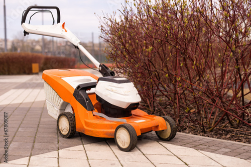 Automatic lawnmower in modern garden