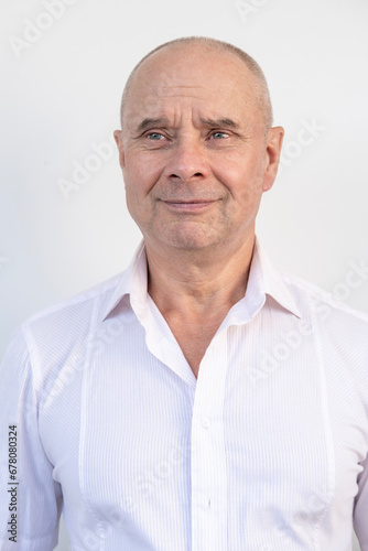happy elderly gentleman, caucasian mature man 60-65 years old smiling on white background, close-up face, good mood, age-related changes, concept mental human health, optimism in adulthood