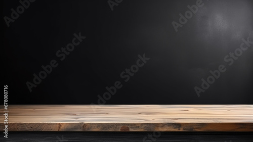 Empty wooden table top on black dark concrete wall