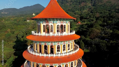 Aerial 4k footage of Wuji Tianyuan Temple by drone in Tamsui, New Taipei City, Taiwan. A famous Taiwan temple that have cherry blossoms during spring. photo