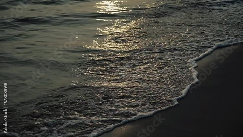 Tilt Up Shot Of Shoreline Beach In Evening