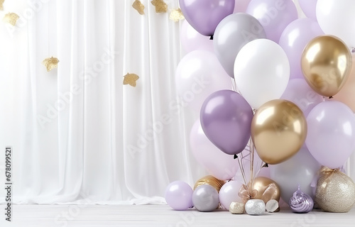 White, lilac and transparent with golden glitter balloons lying on white wooden table soft light top view