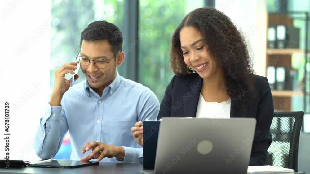 Business team working at office with laptop and documents on desk, financial adviser analyzing data. Business team working at office with laptop and documents on desk, financial adviser analyzing data.