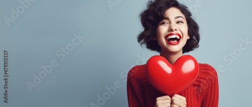 Portrait of a happy woman with red heart.Valentine's Day Concept