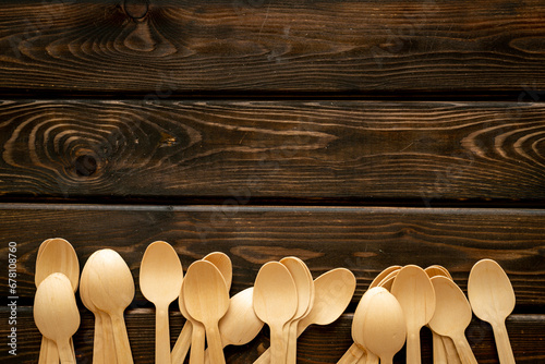 Frame of wooden eco friendly cutlery spoons. Zero waste concept