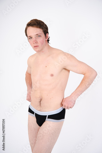 A young attractive guy posing in the studio.