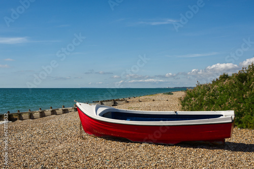 Beach with boat at East Preston near Littlehampton, West Sussex,  England