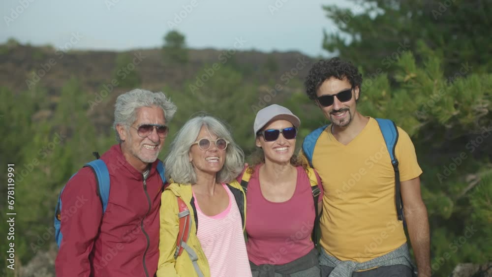 Front View of Diverse Four Walkers Embracing in Forest Front View of Diverse Four Walkers Embracing in Forest
