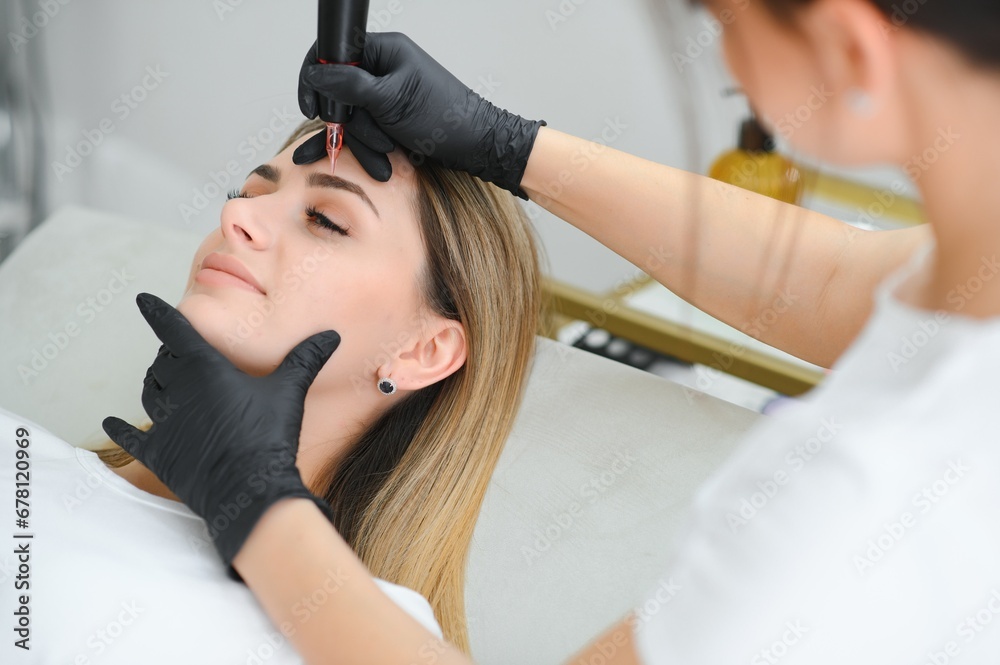 Permanent makeup. Permanent tattooing of eyebrows - obrazy, fototapety, plakaty 