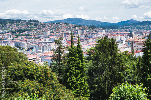 The view from the hill in Parque Monte del Castro  park located on a hill in Vigo  the biggest city in Galicia Region  in the North of Spain. View of the sea  houses and trees  selective focus