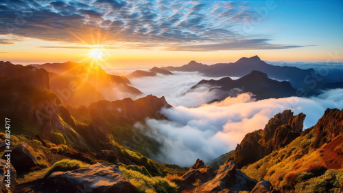 Beautiful sunrise over the clouds in the mountains. Landscape.