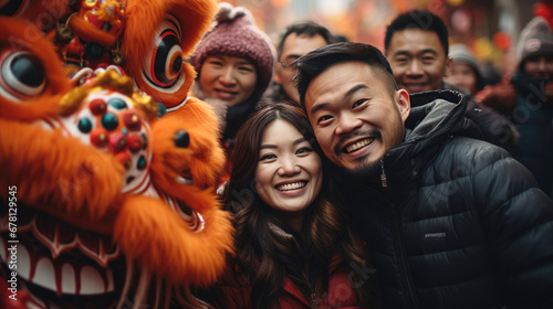 Happy people in front of a Chinese lion celebrating Chinese new year