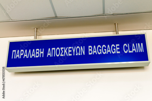 Bilingual sign in a Greek airport for Baggage claim (sic) photo