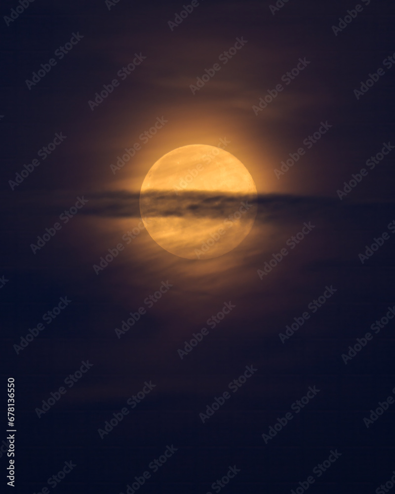 Yellow full moon in northern France in summer