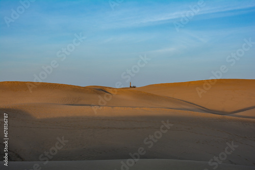 Sand dunes of Maspalomas with lighthouse on Gran Canaria, Spain