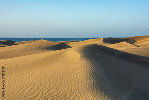 Sand dunes with a view to the sea