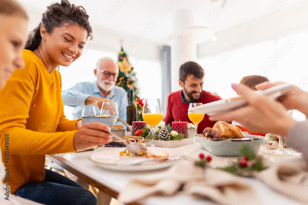 Family having Christmas dinner all together at home