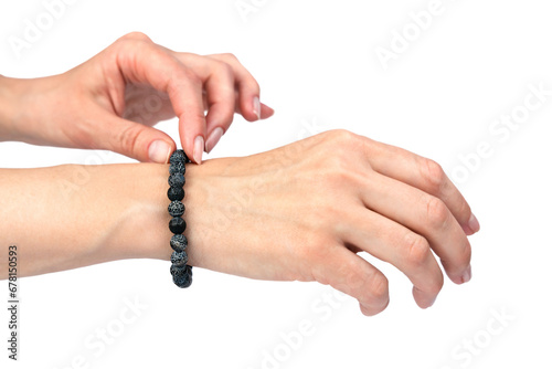 Natural stone bracelet on a woman's hand isolated on a white background. Close-up.