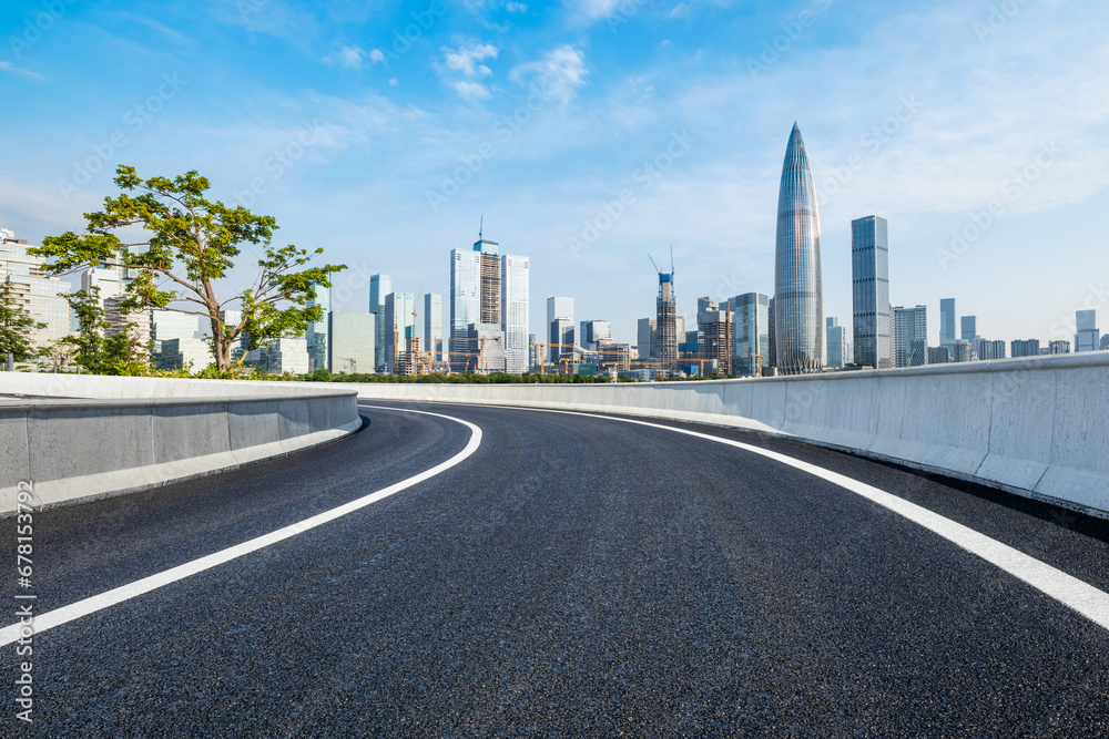 Asphalt highway and city skyline scenery in Shenzhen, Guangdong Province, China. Road and city buildings background.