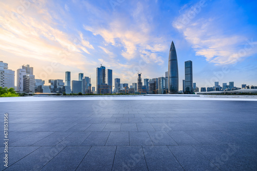 City square and skyline with modern buildings in Shenzhen at sunset, Guangdong Province, China. Empty square floor and city building background. © ABCDstock