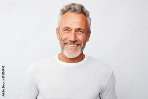 Portrait of a cheerful man in his 50s showing off a thermal merino wool top against a white background. AI Generation