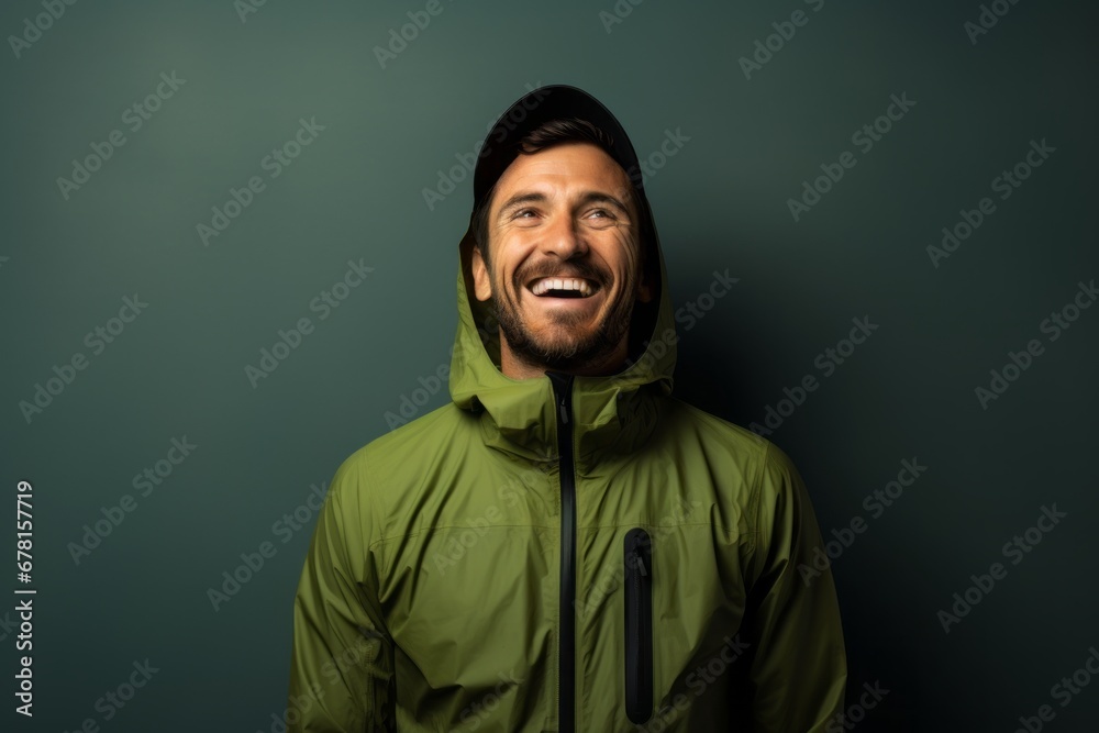 Portrait of a happy man in his 30s wearing a windproof softshell against a modern minimalist interior. AI Generation Portrait of a happy man in his 30s wearing a windproof softshell against a modern minimalist interior. AI Generation