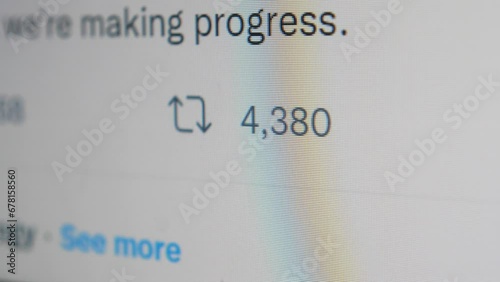 User clicking retweet button on a popular post social media, close up of a computer screen view