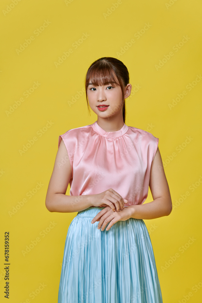 Photo of wonderful female model isolated on yellow background. Photo of wonderful female model isolated on yellow background.