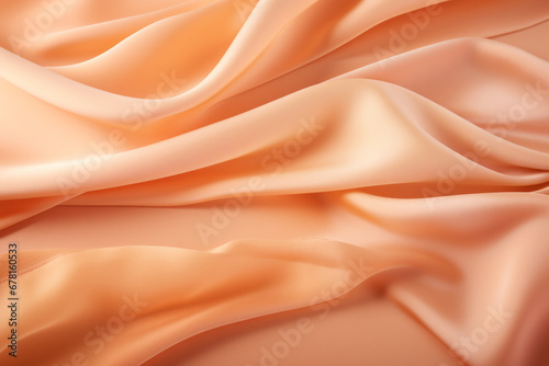 Orange apricot colour silk wave drapery abstract background. Flowing fabric texture concept