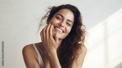 Beautiful woman applying moisturizer cream on her hands. Photo of smiling woman with perfect skin  on white  background. Beauty concept photo