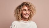 Smiling young woman with blonde curly groomed hair isolated on pastel flat background with copy space. Blonde hair care products banner template, hair salon.
