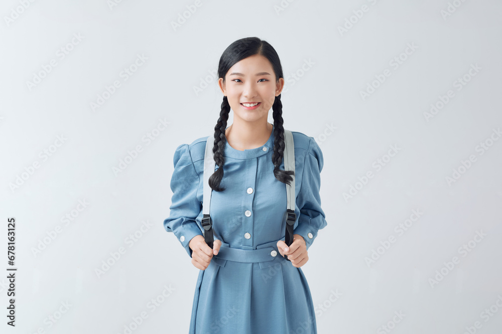 happy beautiful young woman smiling and pointing away over white background happy beautiful young woman smiling and pointing away over white background