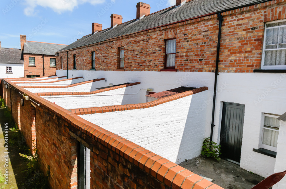 Back yards of a row of Victorian terraced houses at the Ulster Folk Park Museum