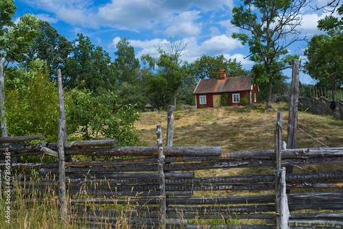 Well preserved old historical hamlet and the surrounding landscape in Stensjo by, Sweden photo