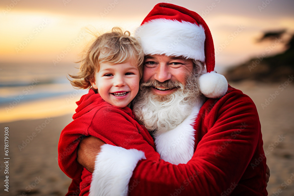 Obraz premium Santa Claus and little boy on the beach at Christmas time. Happy family. Selective focus