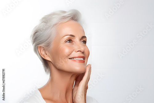 Beautiful smiling elderly woman  with smooth healthy skin. Beautiful mature  woman portrait