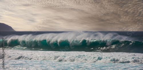 Tubular waves developing late in the afternoon at Sunset Beach, Oahu, Hawaii.