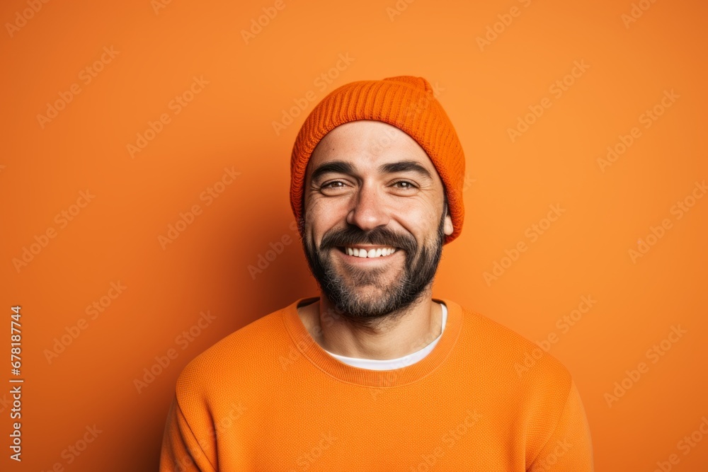 Portrait of a cheerful man in his 30s sporting a trendy beanie against a pastel orange background. AI Generation Portrait of a cheerful man in his 30s sporting a trendy beanie against a pastel orange background. AI Generation