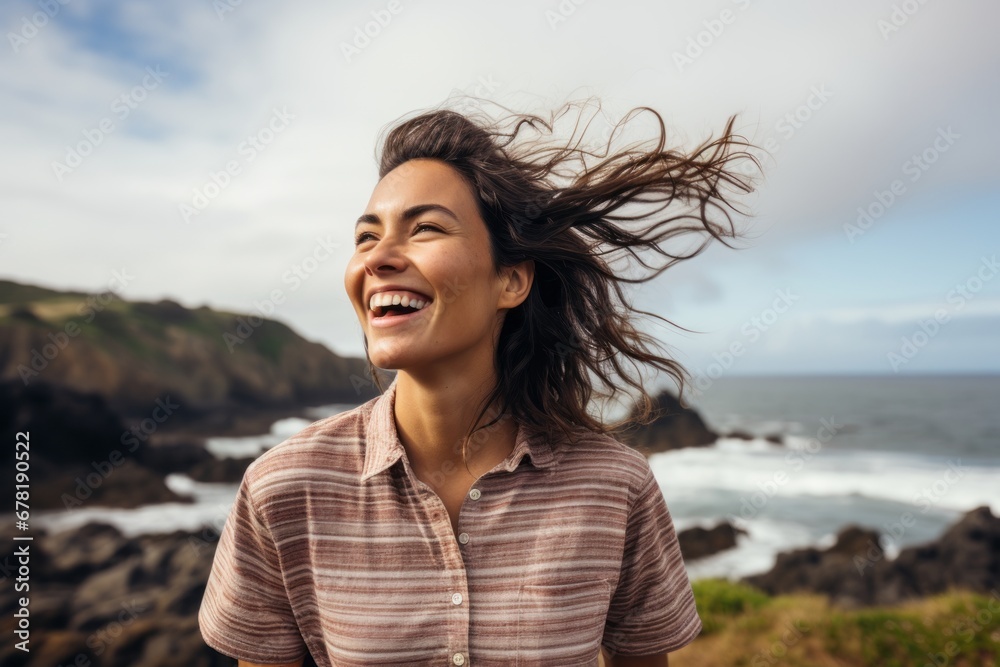 Portrait of a joyful woman in her 20s sporting a breathable hiking shirt against a serene seaside background. AI Generation