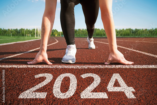 happy new year 2024. concept of starting a business or career in the new year. woman preparing for running. beginning of the 2024 year. transition to new level concept. hope and expectation in 2024.
