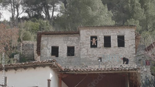 Teddy bear hanging in Albanian house To Keep Evil Eye or Spirit Away, Wide shot