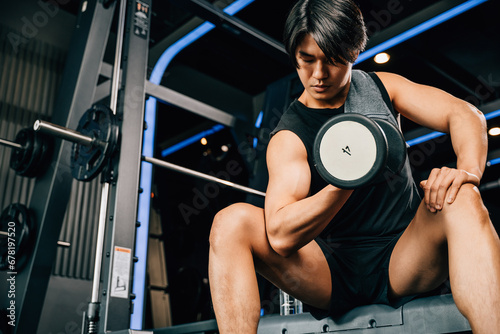 Cuadro en lienzo A muscular adult male in a gym setting, holding a heavy dumbbell and demonstrating the importance of strength training and weightlifting for overall health and wellness